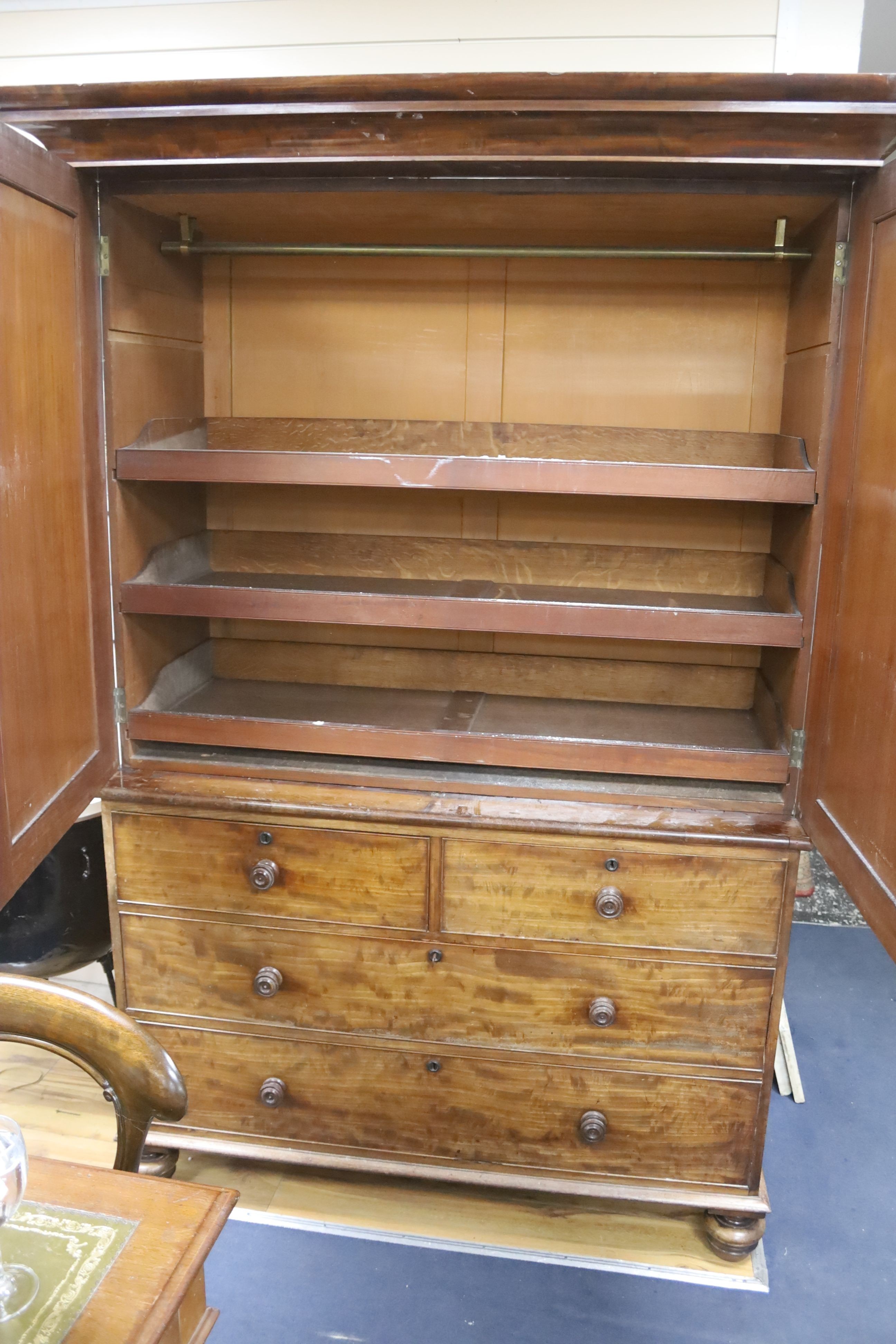 A William IV mahogany linen press, raised over two short and two long drawers, width 132cm, depth 60cm, height 213cm